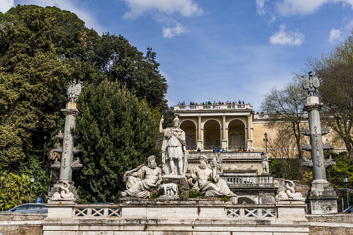 Rome, Italy, January 19 -- The dome of St. Peter's Basilica among the secular pines of the gardens of the Janiculum hill, in the historic center of Rome in the Trastevere district. The Janiculum gardens, on the right bank of the Tiber river, with a series of spectacular terraces overlooking the historic center of Rome. Image in High Definition format.