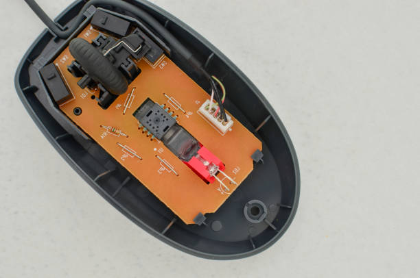 istock Open computer mouse with exposed electronic circuit for maintenance, symbol of technology and modern computing. Perfect for technology concepts, digital age symbol and technology solutions. 1638463332