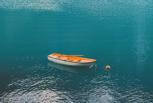 orange boat on a mountain lake in Norway