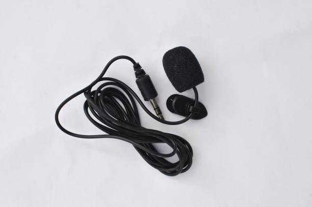 istock Professional lavalier microphone close-up, perfect for high-quality audio recording. Precise and professional audio recording and production concept. 1638496197