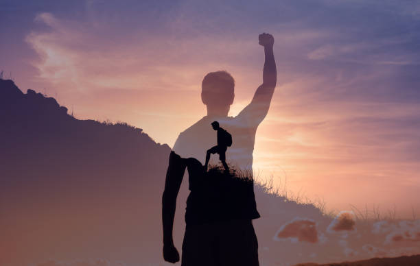 istock Strong man climbing up mountain. Goal settings. 1638508574