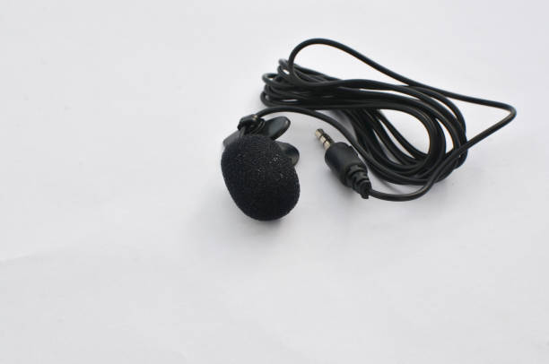 istock Professional lavalier microphone close-up, perfect for high-quality audio recording. Precise and professional audio recording and production concept. 1638517133