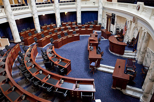 Front seats of the Washington State Senate or House of Representative chamber, reserved for the Speaker of the House/Senate President and clerks.  Location: Olympia, Washington.