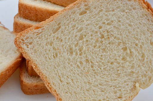 Close up of delicious traditional bread, also known as sliced bread, perfect for creating irresistible sandwiches and ideal for compositions about healthy eating.