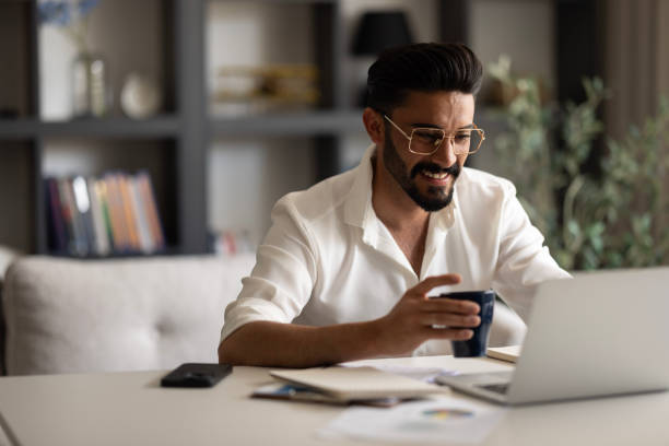 istock Young man working at home in the evening 1638527754