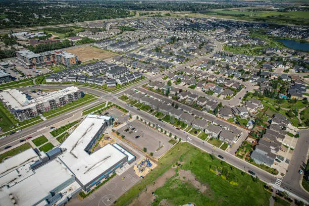 Aerial view of Stonebridge which is a mostly residential neighbourhood located in south-central Saskatoon, Saskatchewan, Canada. It is a suburban subdivision, consisting of low-density, single detached dwellings and a mix of medium-density apartment and semi-detached dwellings.