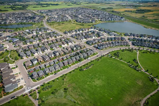 Aerial view of Stonebridge which is a mostly residential neighbourhood located in south-central Saskatoon, Saskatchewan, Canada. It is a suburban subdivision, consisting of low-density, single detached dwellings and a mix of medium-density apartment and semi-detached dwellings.