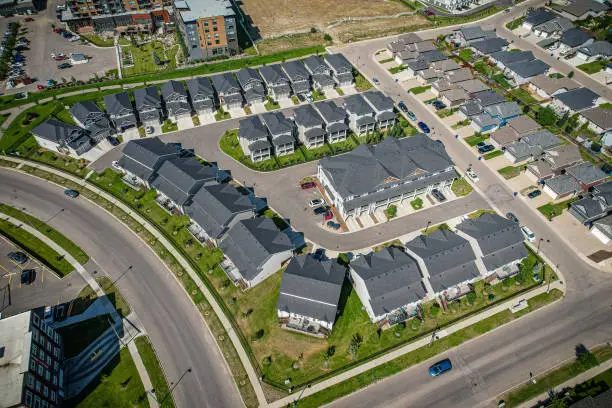 Aerial view of Stonebridge which is a mostly residential neighbourhood located in south-central Saskatoon, Saskatchewan, Canada. It is a suburban subdivision, consisting of low-density, single detached dwellings and a mix of medium-density apartment and semi-detached dwellings.