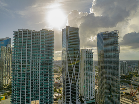 This is a photograph of residential high rise apartment buildings with dark tropical storm clouds in Aventura, Florida at the beginning of hurricane season.