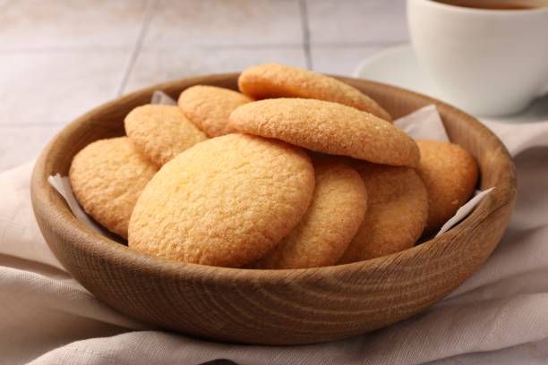 istock Delicious Danish butter cookies on white tiled table, closeup 1638556152