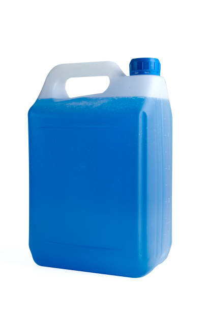 istock Antifreeze coolant in plastic 5 liter canister. Blue liquid for car engine. Half full or half empty container isolated on white background. 1638561516