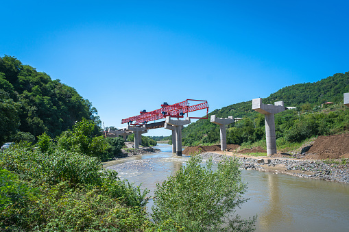 Newly built bridge under construction over the river, Georgia