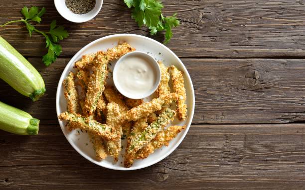 istock Crunchy zucchini breaded sticks with dip sauce 1638603436