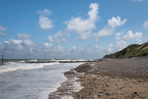 Mundesley is a good old fashioned English holiday destination and very typical of the north Norfolk coast. Coastal erosion is seen all along the cliffs with worn and decaying sea defences.