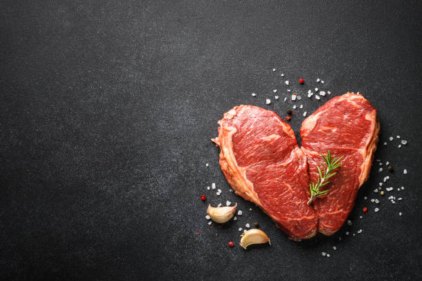 istock Fresh beef meat steaks on black. 1638624617