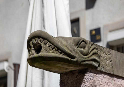 Gdansk, Poland - June 2, 2023:  Mariacka street, grotesque gargoyle on front of tenement house. The street is famous for its unique architecture and shops with beautiful amber jewelry