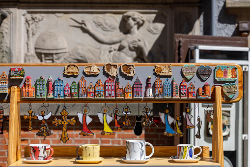 Gdansk, Poland - June 2, 2023: A souvenir shop on Mariacka Street, fridge magnets in the shape of tenement houses in the Old Town and hand-painted cups