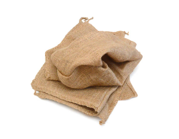 istock Hessian sack with ties forming over white background. 1638639085