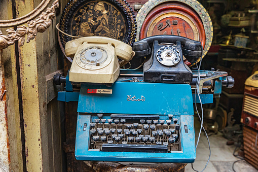 Africa, Egypt, Cairo. Telephones and a typewriter at an antique shop.