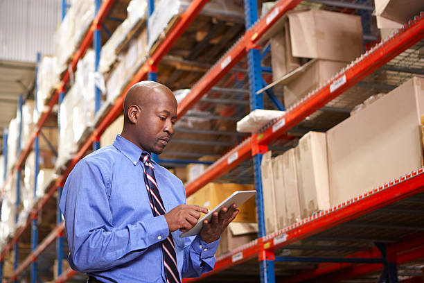 istock Businessman With Digital Tablet In Warehouse 163869640