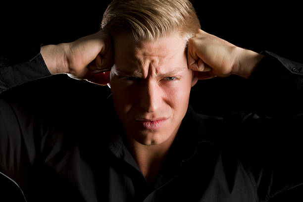 istock Low key portrait of overburdened young man. 163869684