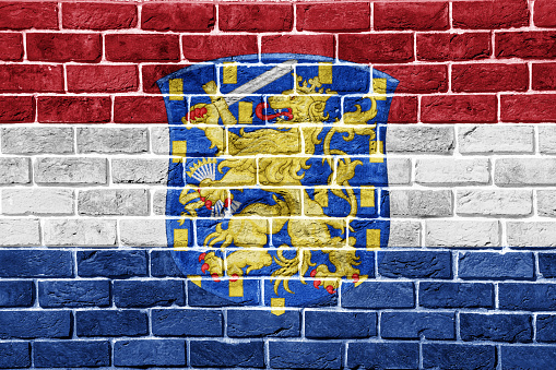 Flag and coat of arms of Caribbean Netherlands on a textured background. Concept collage.