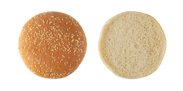 Sesame bun for burger half cutted top view isolated on white