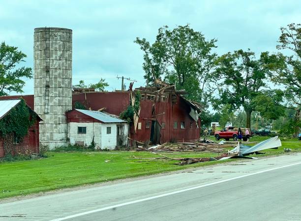 Barn destroyed by a tornado in Michigan, August 2023. Barn suffering much damage from a tornado in August of 2023. michigan farmland stock pictures, royalty-free photos & images