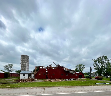 Barn suffering much damage from a tornado in August of 2023.