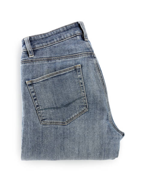 istock Folded light blue jeans isolated on white, top view 1638729244