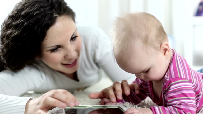 HD: Baby and mother with tablet