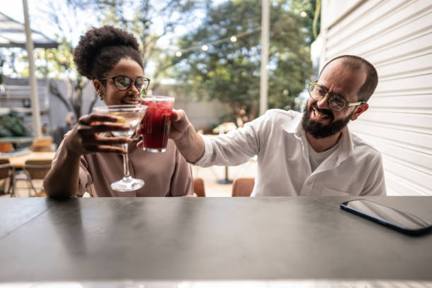 istock Coworkers toasting with drinks on a pub 1638758391
