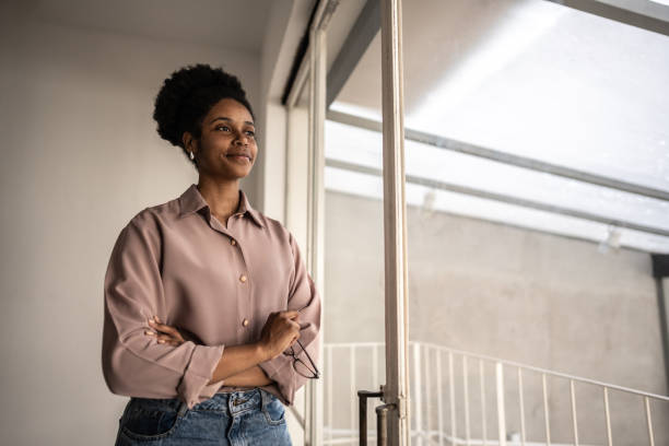 istock Businesswoman contemplating looking away looking through window 1638759424