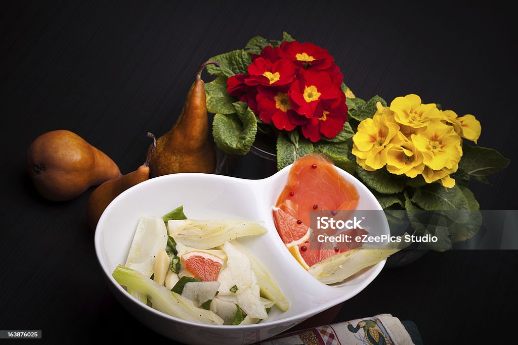 Salad Of Fennel, Pears And White Cheese Bowl with salad of fennel, pears and white cheese together with smoked salmon. Appetizer Stock Photo