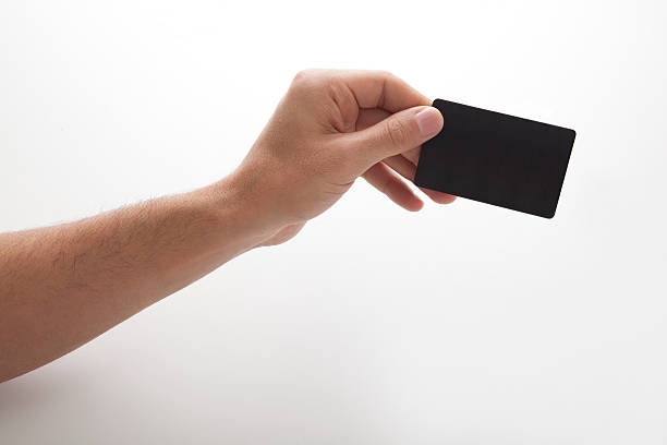 istock Empty business card in man's hand on white background 163876259