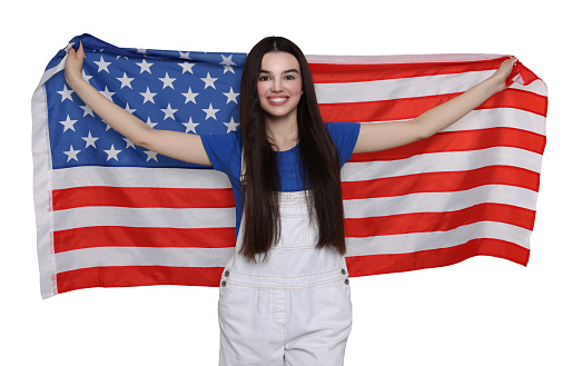 4th of July - Independence day of America. Happy teenage girl holding national flag of United States on white background
