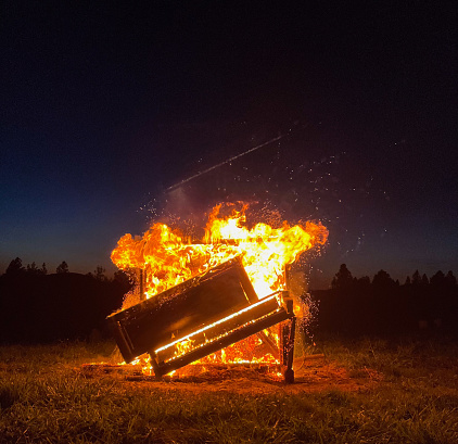 Piano burning in a field in Northern California in Nevada City, California, United States