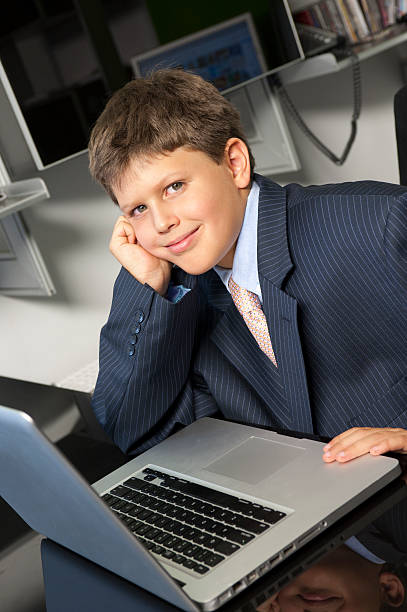 Executive kid at office stock photo