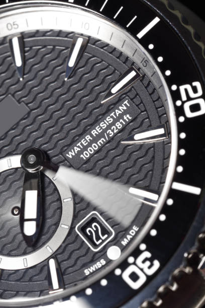 Detail macro of a water resistant wrist watch, minute and second hands are on the move