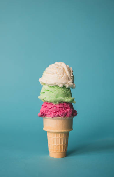 istock Ice cream cone with three scoops on a blue background. 1638780158