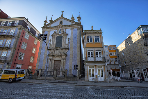 Street view of historic Ribeira district in the morning, Porto, Portugal. Church of St. Nicholas in the picture.