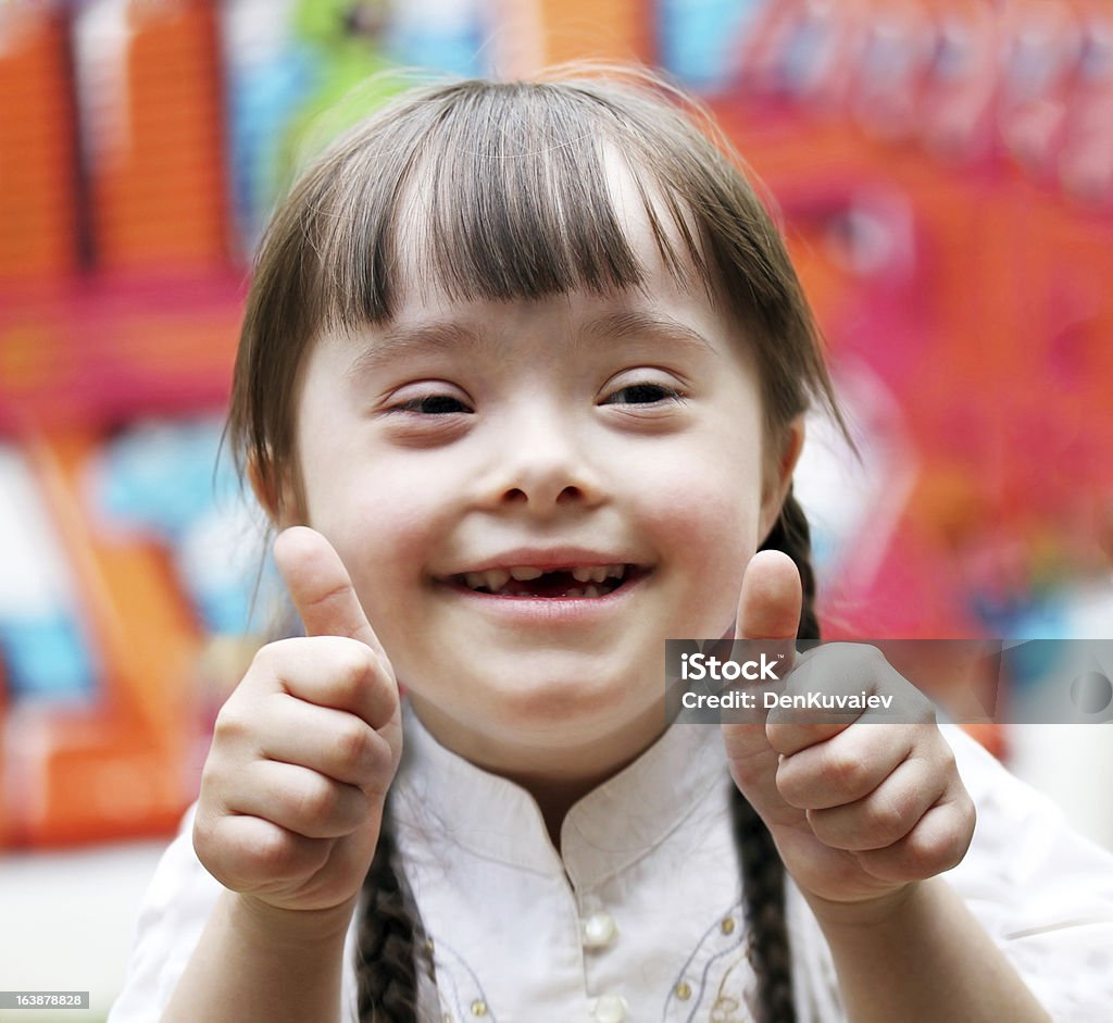 Portrait of girl Portrait of beautiful happy girl giving thumbs up. Child Stock Photo