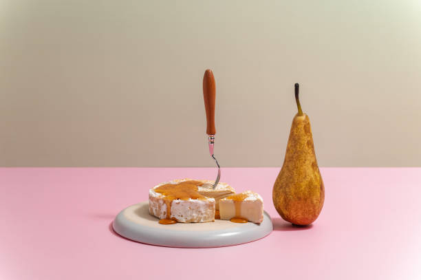istock brie cheese on a plate with honey and pear 1638795584