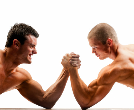 arm wrestling nude muscular build men on white background