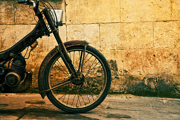 Vintage motorcycle against wall