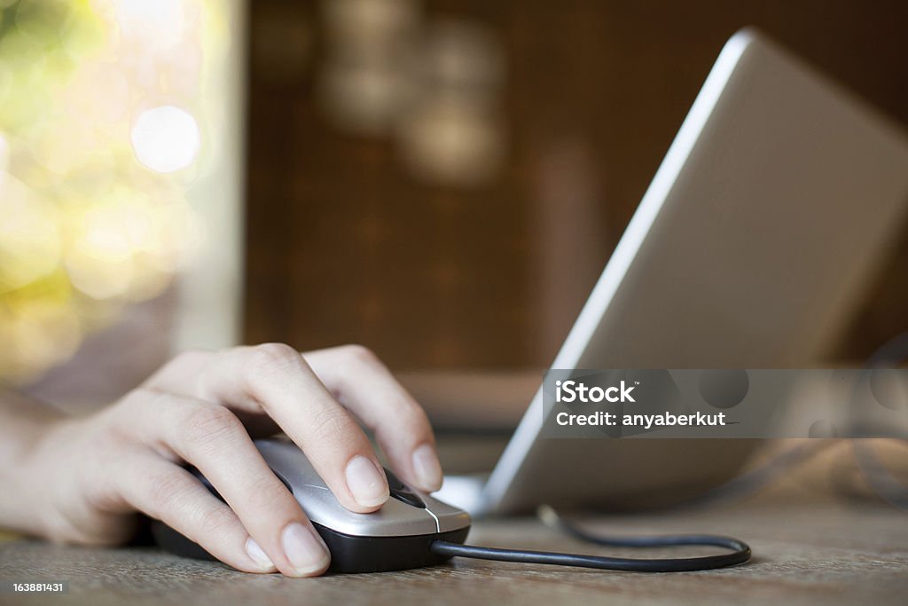 internet mouse click, woman hand with mouse and laptop Abstract Stock Photo