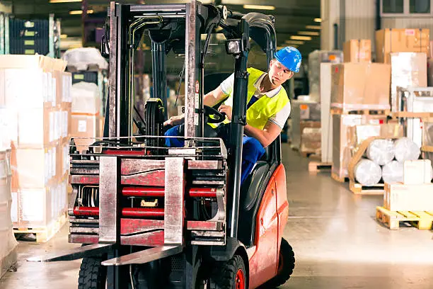 Photo of forklift driver at warehouse of forwarding