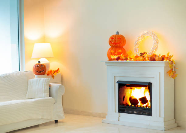 istock Halloween home decoration. Pumpkin on fireplace. 1638832305