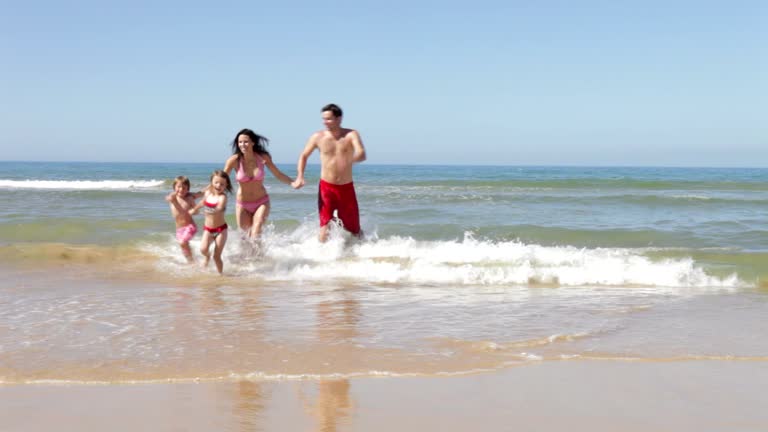 Family Enjoying Beach Holiday Together