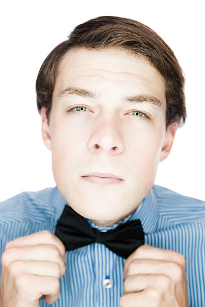 istock Handsome old-fashioned gentleman adjusting his bow tie 163885472